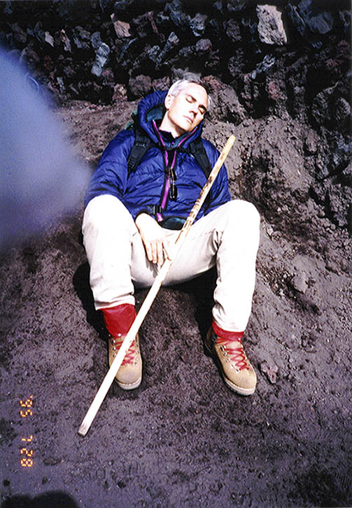 George Fisher resting after climbing to the top of Mt. Fuji in Japan